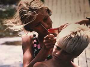 Karin practises cutting her brothers hair.